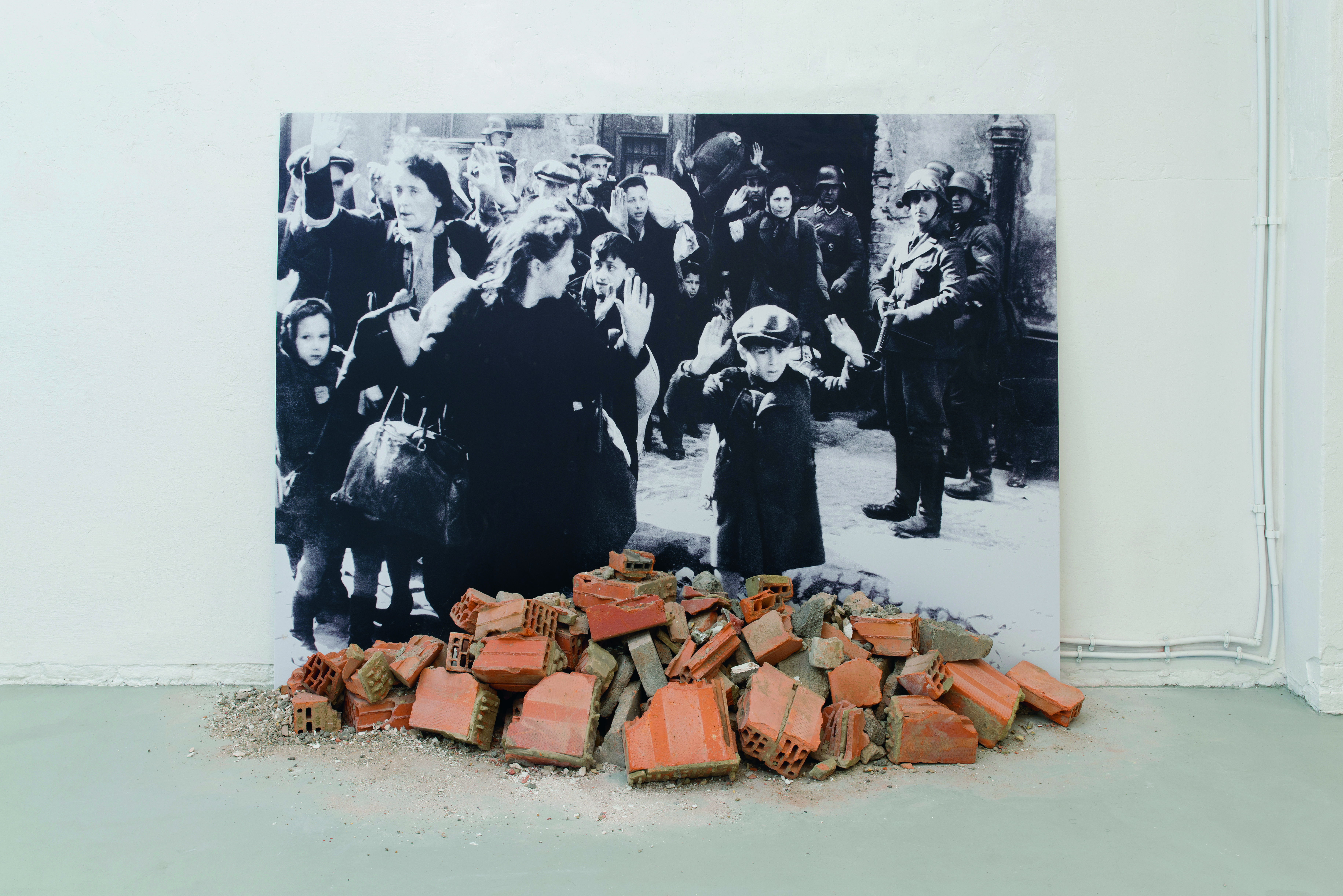 Gustav Metzger, ‘Historic Photographs: No. 1: Liquidation of the Warsaw Ghetto, April 19-28 days, 1943’ , 1995-2020, black and white photograph, rubble, 150 x 211 cm – authorized reconstruction by The Gustav Metzger Foundation courtesy of The Gustav Metzger Foundation and Hauser & Wirth