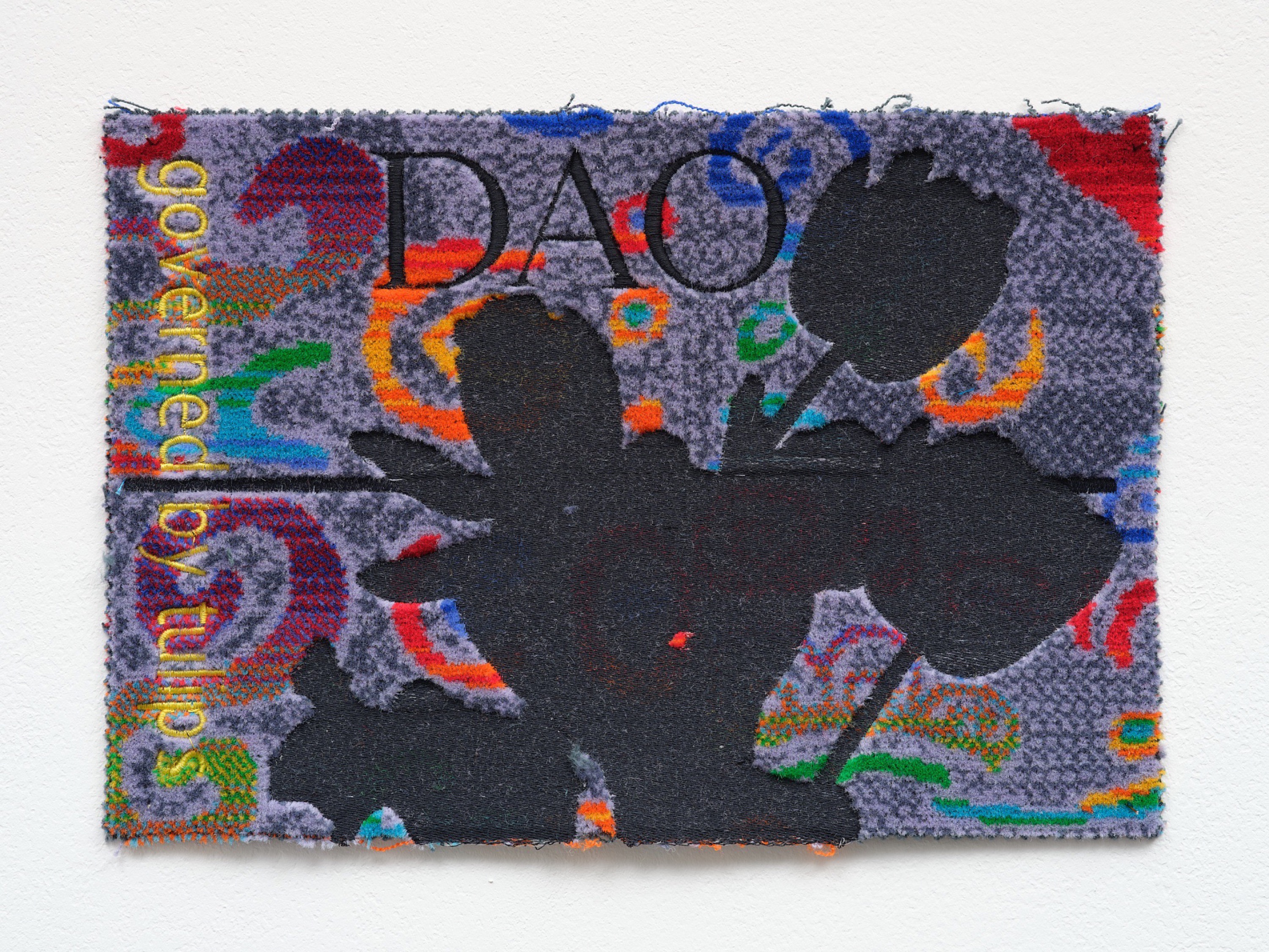 Metahaven, DAO (Governed by Tulips) [Bus seats] , 2023, borduurwerk op busstoelstof, 20 x 30 cm, foto We Document Art